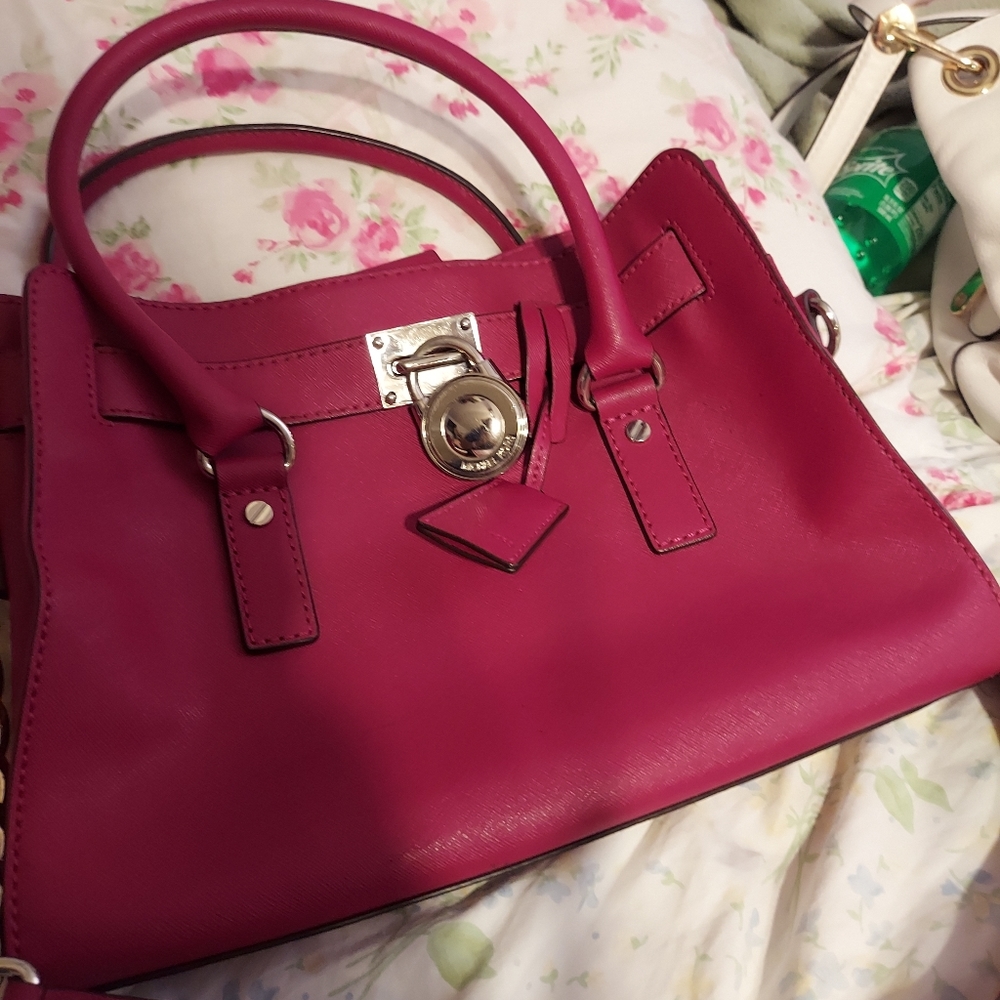 Michea kors purse . Dark pink . Spacy , long strap short strap  in veru good con